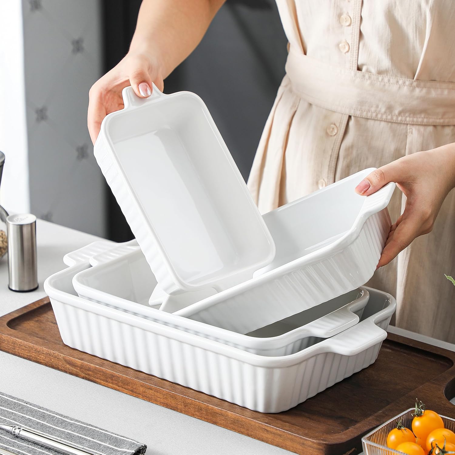 Set of 4 white ceramic rectangular baking dishes with handles, graduated sizes for lasagna and cake baking — view 4