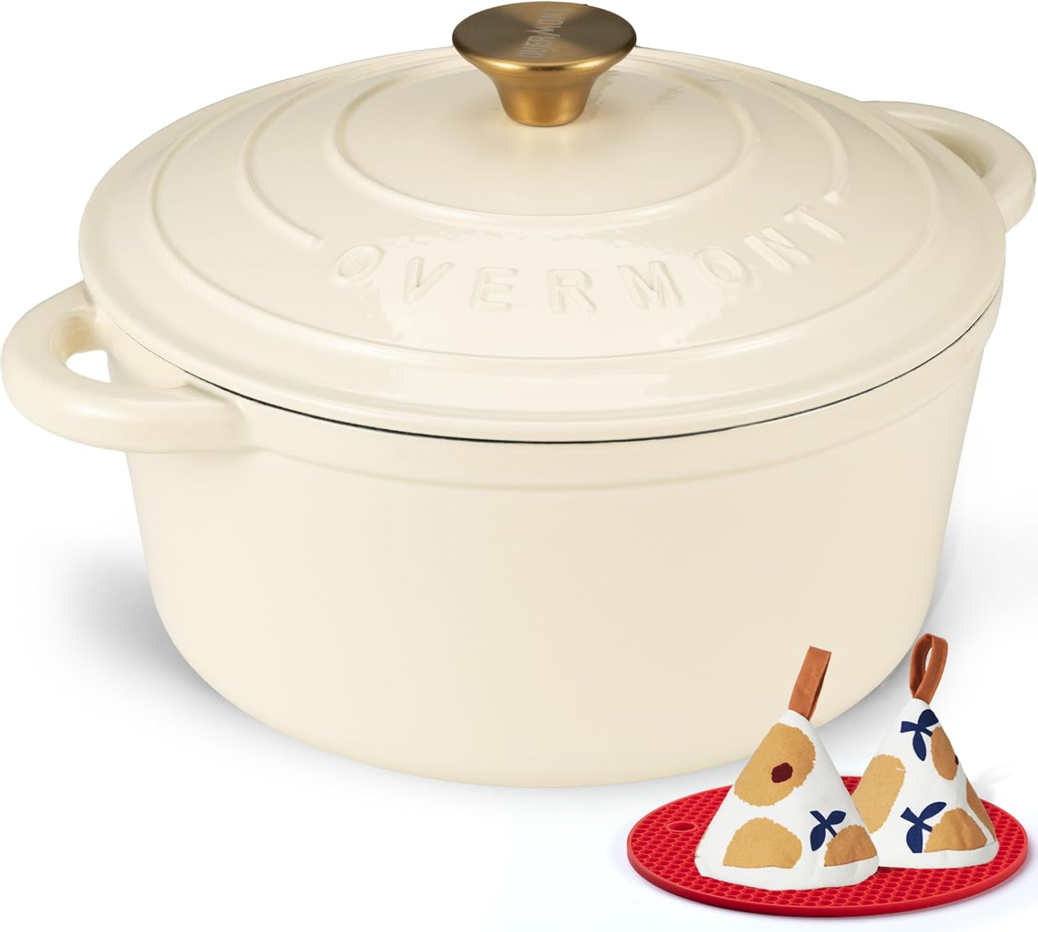 Cream white enameled cast iron Dutch oven with matching lid, displayed with included cookbook and cotton potholders — view 1