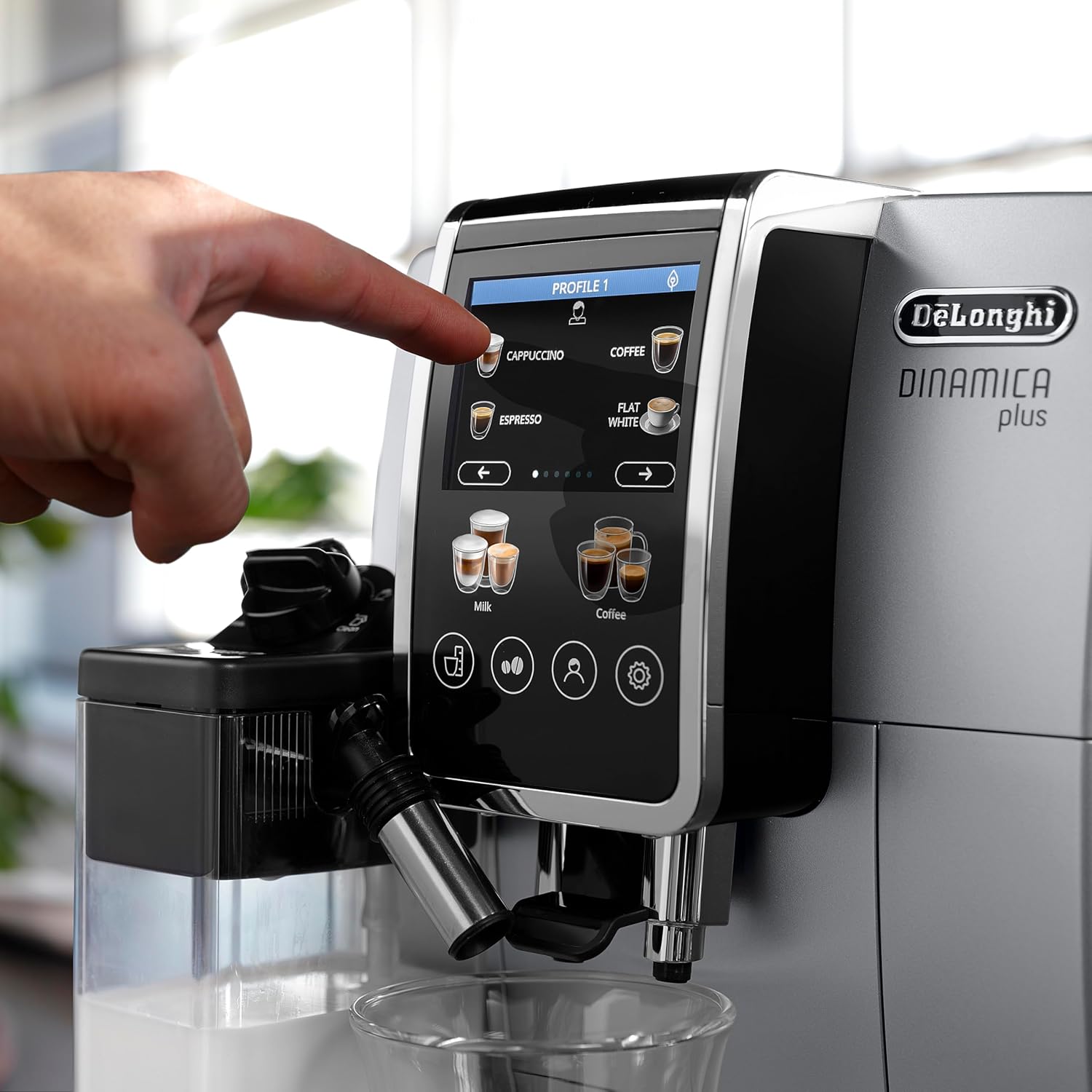 Stainless steel De'Longhi Dinamica Plus fully automatic espresso machine with integrated grinder and milk frother on countertop — detail