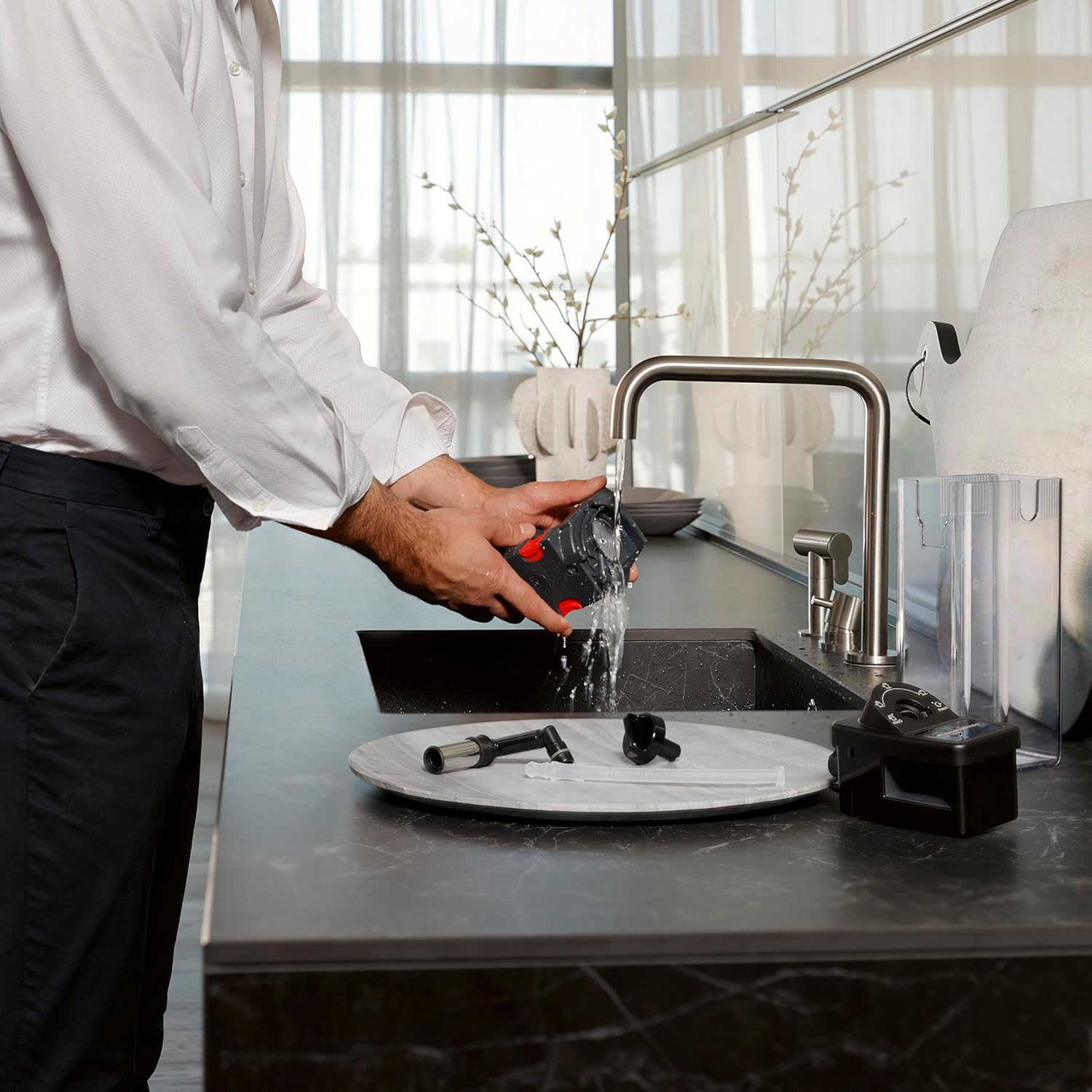 Stainless steel De'Longhi Dinamica Plus fully automatic espresso machine with integrated grinder and milk frother on countertop — view 3