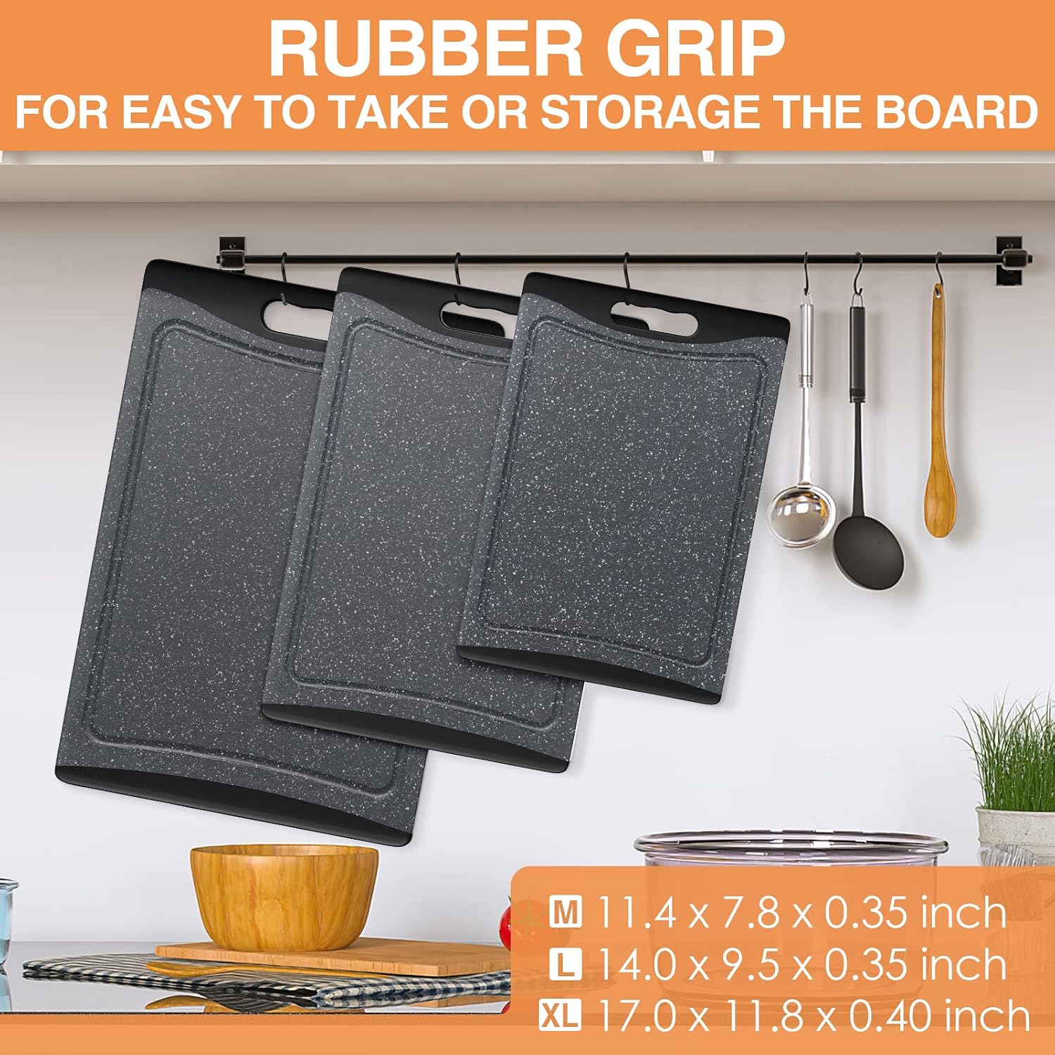 Dark grey plastic cutting board with juice grooves and easy-grip handles, part of 3-piece kitchen set — detail