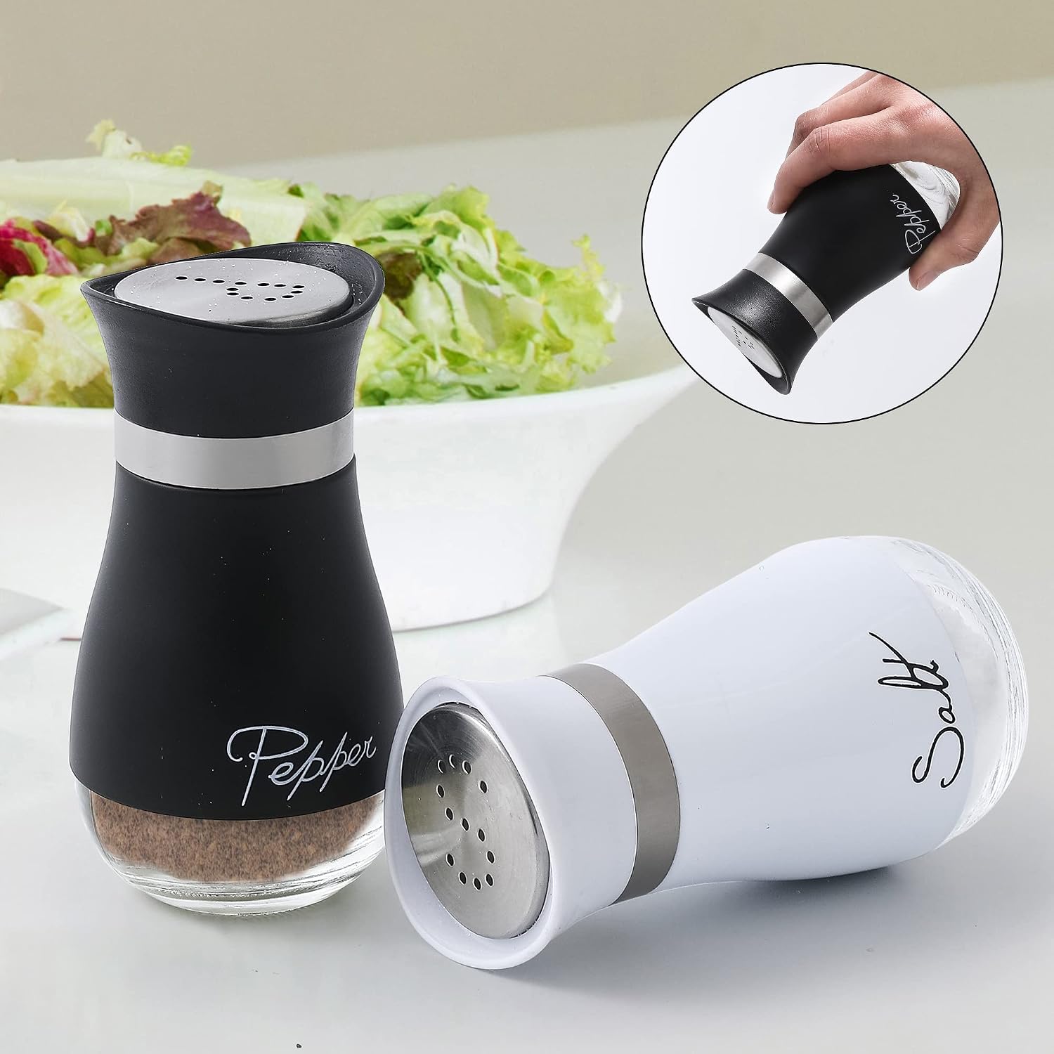 Ceramic salt and pepper shaker set in white, handheld design for kitchen table use โ side