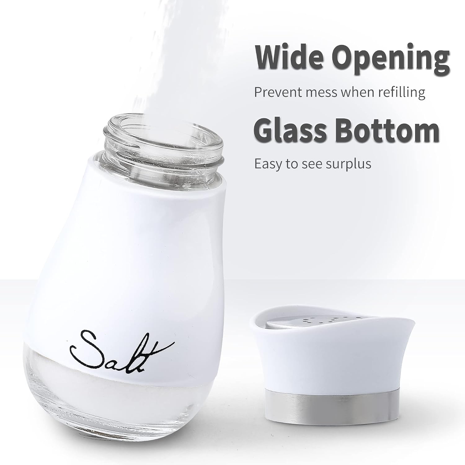 Ceramic salt and pepper shaker set in white, handheld design for kitchen table use โ detail